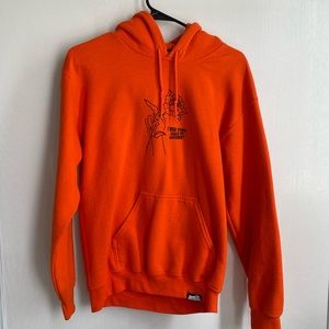 Very bright neon orange BROKEN PROMISES hoodie